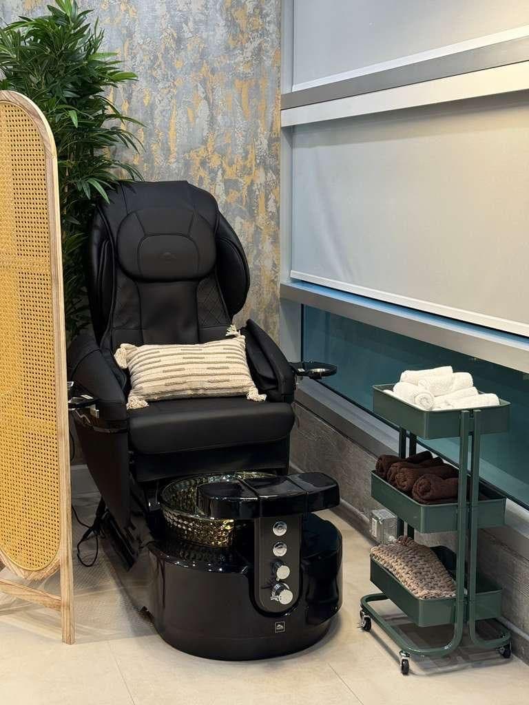 Pedicure station with luxury chair and towel cart